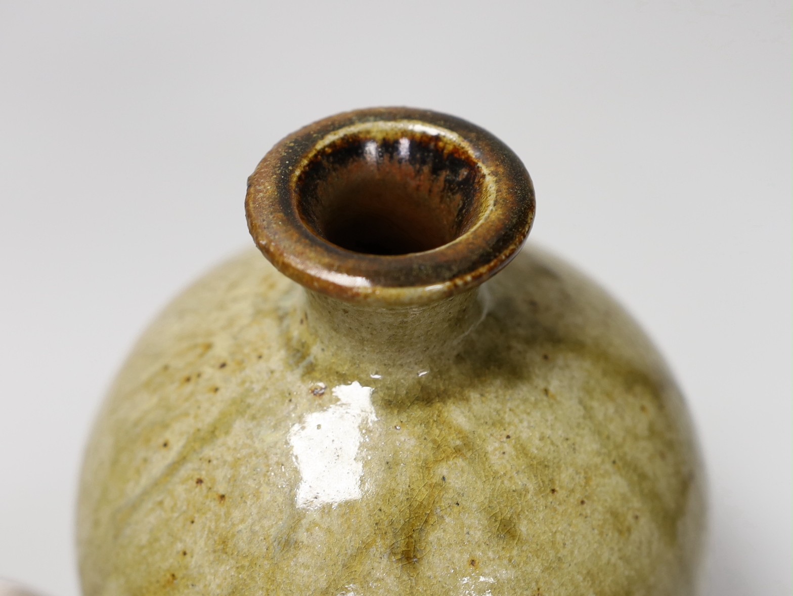 David Leach (1911-2005) small candlestick, together with a Nick Rees stoneware vase. Tallest 18cm